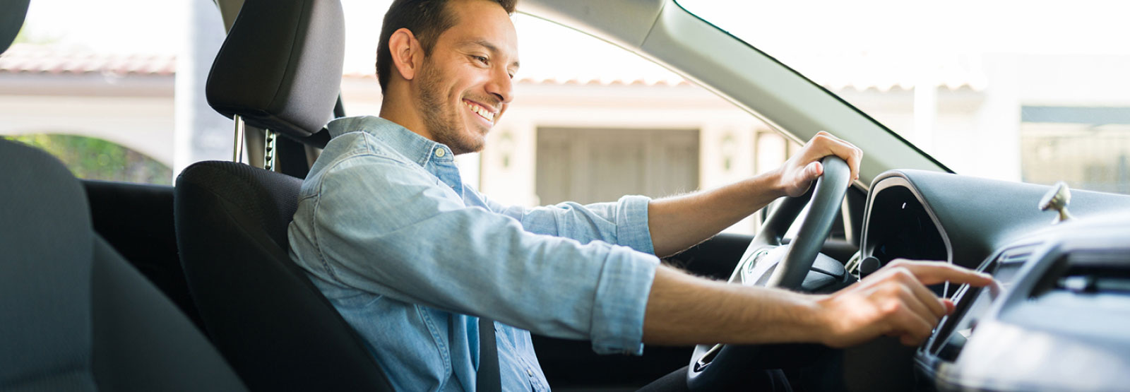 Young man in a new automobile